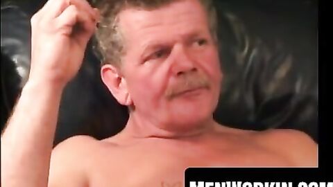 Muscular plumber strokes his stiff fat cock slow