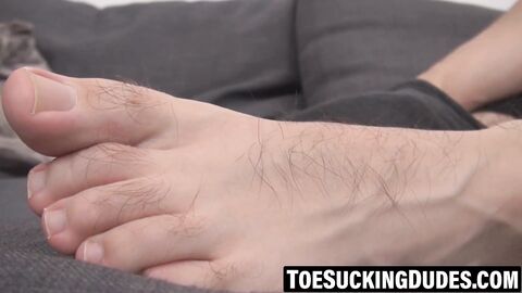 Athletic man masturbates using both hands and foot stimulation