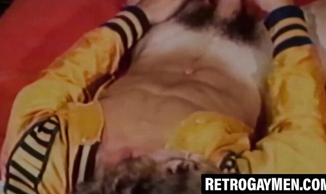Curly stud Kip Noll strokes his cock with wild intensity