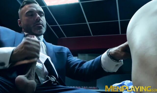 Elegant hunk wears slick blue suit while ramming hot stud
