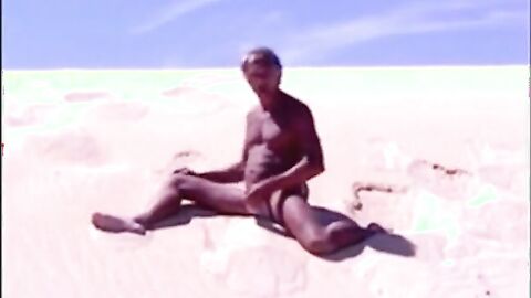 Tanned guy on beach in tiny string thong (temporarily!)