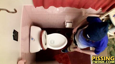 Devin Reynolds grabs his cock and unloads in the toilet|