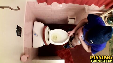 Devin Reynolds grabs his cock and unloads in the toilet|