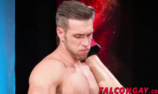 Blue muscle hunk fucks his red friend doggystyle