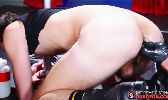 BDSM fisting with black gloves for submissive hunks