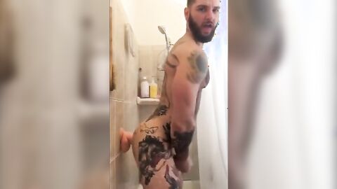 Tatted Hunk Fucks Dildo in Shower Until He Cums