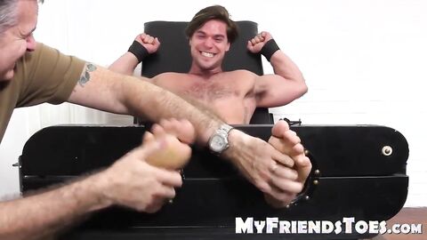 Hunk Aspen gets laughing  as he gets tickled on strap chair