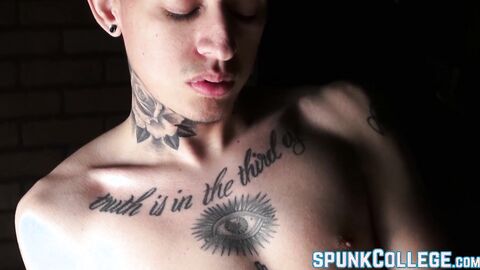 Inked twink teasing while stroking cock passionately solo