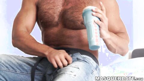 Hairy guy pleases himself with a sex toy and gets aroused