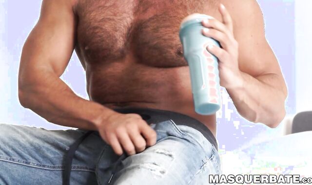 Hairy guy pleases himself with a sex toy and gets aroused