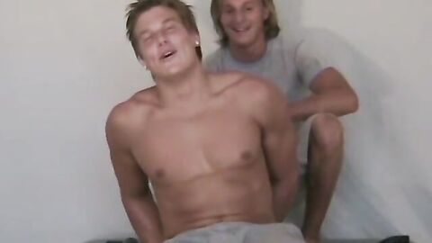 Blond muscular Peyton getting his feet tortured by tickle