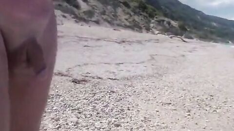 Walking along a beach naked