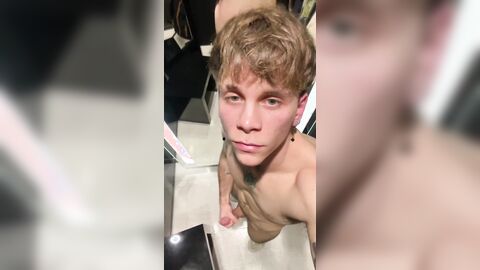 Handsome guy jerks off in the Fitting room