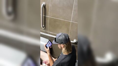 Spy a guy with a Huge dick jerking off in public toilet