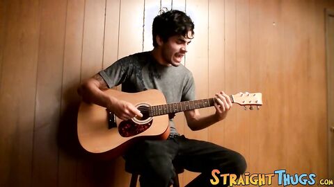 Handsome young man enjoys his guitar and jerkoff solo