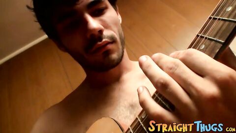 Handsome young man enjoys his guitar and jerkoff solo