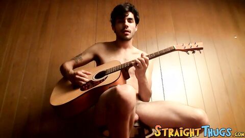 Handsome young man enjoys his guitar and jerkoff solo