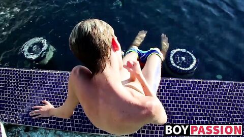 Blonde twink Tyler Thayer jerking his cock near the pool