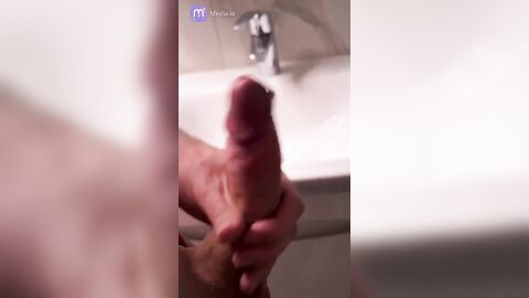 Cute hunk jerks off and cums in the bathroom