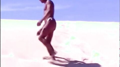 Tanned guy on beach in tiny string thong (temporarily!)