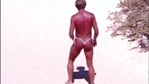 Tanned guy on beach in tiny string thong (temporarily!)