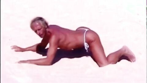 Tanned guy on beach in tiny string thong (temporarily!)