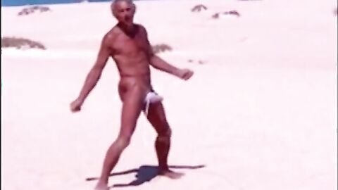 Tanned guy on beach in tiny string thong (temporarily!)