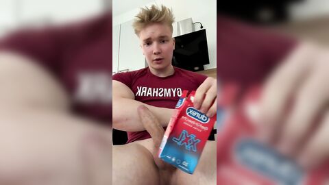 German blond Tim jerking off and cumming in a condom