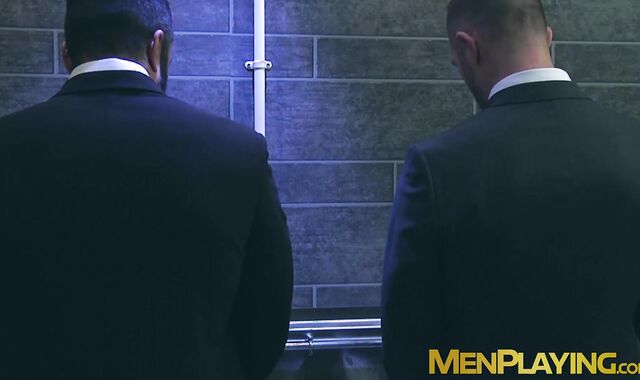 Sexy men in suit gets steamy on rough gay sex in a restroom