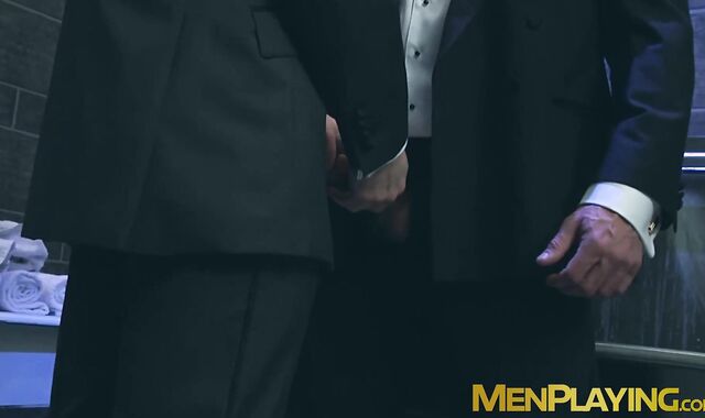 Sexy men in suit gets steamy on rough gay sex in a restroom