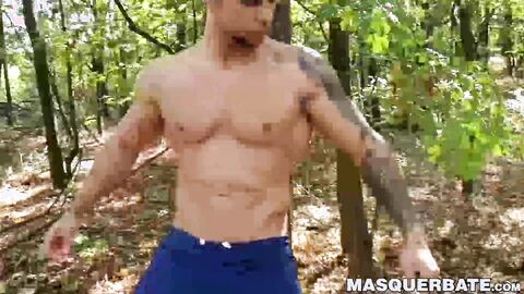 Muscular stud Angelo Godshack wanks off his cock outdoors