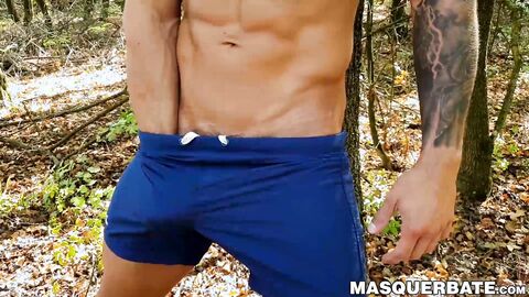 Muscular stud Angelo Godshack wanks off his cock outdoors