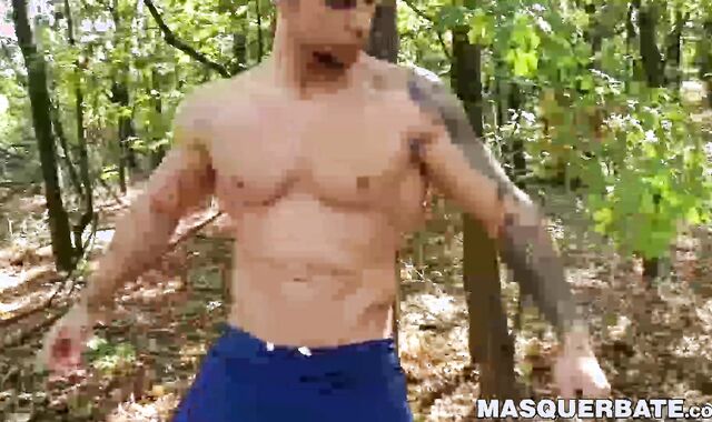 Muscular stud Angelo Godshack wanks off his cock outdoors