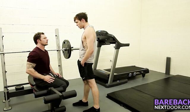 Tattooed hunk fucking this skinny dude in the ass at the gym