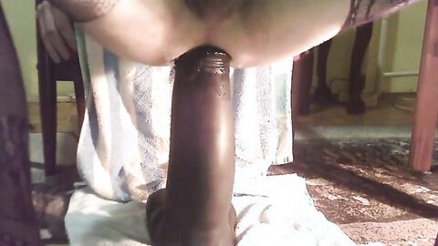 Hard riding big black dildo