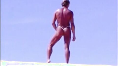 Tanned guy on beach in tiny string thong (temporarily!)