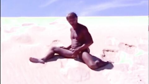 Tanned guy on beach in tiny string thong (temporarily!)