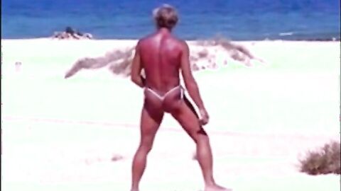 Tanned guy on beach in tiny string thong (temporarily!)