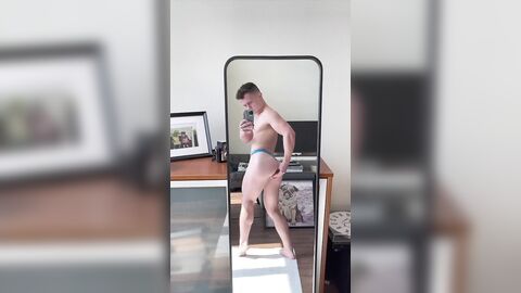 Lucas inserts a dildo in his ass in front of the mirror