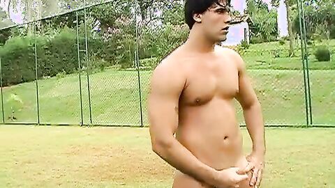 Horny Brazilian jock jerking off his throbbing cock outdoors