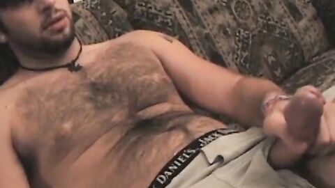 Amateur twink with shaggy hair plays with his dick solo