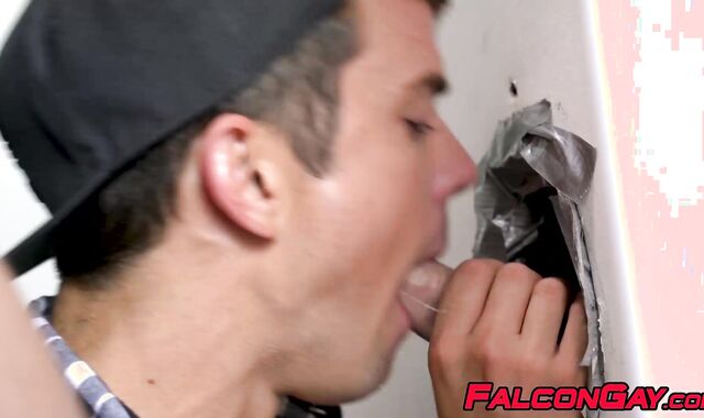 Muscly gay swallows massive hard dicks in public toilet