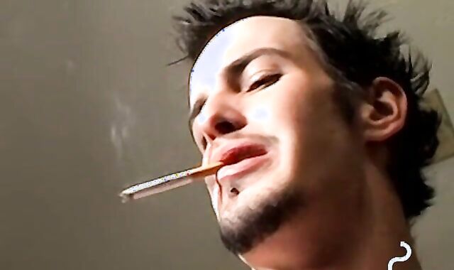 Axel loves pleasing his big dick with a blow of smoke