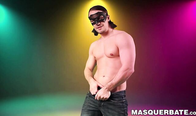 Masked hunky gay strips naked and strokes his cock