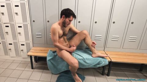 Playing with feet and dick in the locker room