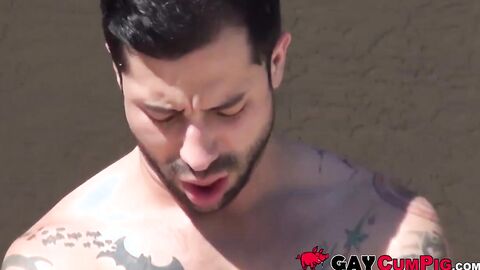 Tattooed jock gets an intense deepthroat from bearded teen