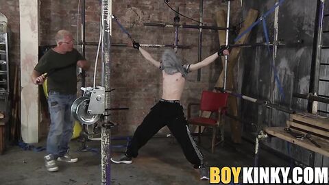 Young bound slave whipped and cock jerked by old deviant