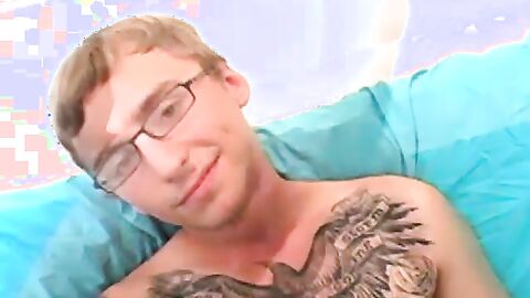 Geeky amateur with glasses and tattoos strokes his big cock