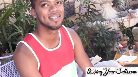 Youthful black person flaunts his balls and jerks off performance