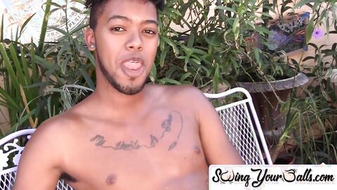 Youthful black person flaunts his balls and jerks off performance